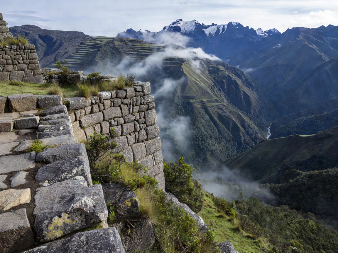 Edge of an ancient stone terrace overlooking a deep Andean valley